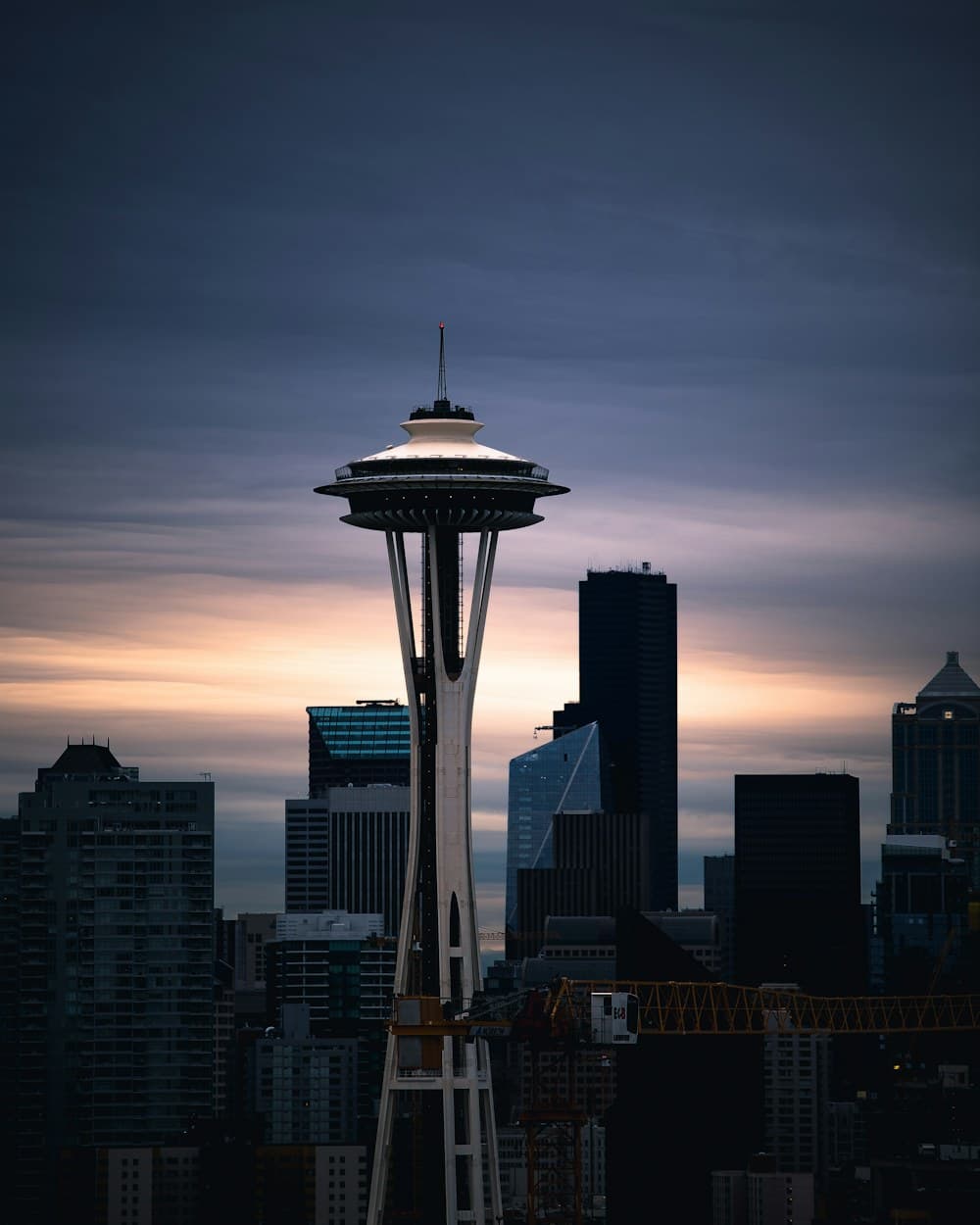 The Space Needle standing over the downtown Seattle skyline at first light