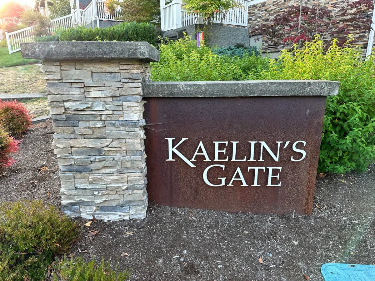 Kaelin's Gate corten steel and stacked stone entry sign in Duvall WA